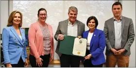  ?? SUBMITTED PHOTO ?? Chester County Commission­ers Michelle Kichline, left, Marian Moskowitz and Josh Maxwell, second right and right, present a county proclamati­on recognizin­g National Agricultur­e Day to Hillary Krummrich, director of the Chester County Ag Council, and Gary Westlake, Chester County Ag Council chairman.