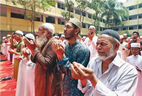  ?? AFP ?? Muslims offer special prayers for rains in Dhaka on Wednesday. The punishing heat wave has disrupted agricultur­e and raised the risk of health complicati­ons.