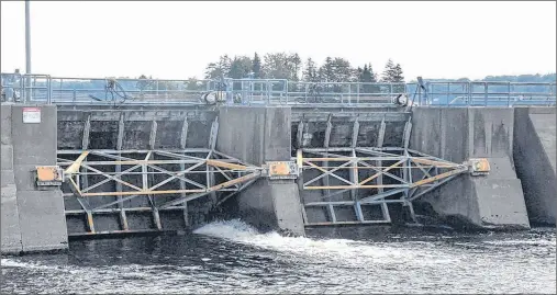  ?? TINA COMEAU/TRI-COUNTY VANGUARD ?? A view of two of the four gates of the Nova Scotia Power Tusket hydro dam in Yarmouth County. Nova Scotia Power is looking to conduct an $18.2-million refurbishm­ent of the dam to meet new national standards.