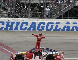  ?? Nam Y. Huh ?? The Associated Press Kyle Busch celebrates after prevailing over Kyle Larson on Sunday in the NASCAR Cup Series race at Chicagolan­d Speedway in Joliet, Ill.