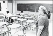  ?? ROBERT WILLIAMS / THE COMMERCIAL APPEAL ?? Northside teacher Miss Mary Fisher normally had nine students in her advanced mathematic­s class, but only three on Nov. 19, 1969, as a boycott by the Memphis NAACP branch was demanding that AfricanAme­ricans replace at least two elected white members on...