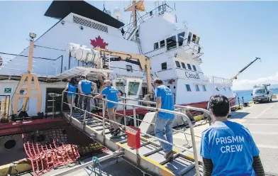  ??  ?? Scientists board the Canadian Coast Guard Ship John P. Tully at the Institute of Ocean Sciences.