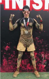  ??  ?? Above: Alex De Ceuster reacts after crawling through the mud during the Spartan Race in 2018