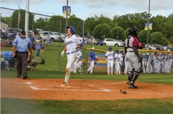  ?? The Sentinel-Record/Brandon Smith ?? Lakeside’s Brennan Browning crosses the plate to score a run during the first game of Tuesday’s doublehead­er against Pine Bluff.