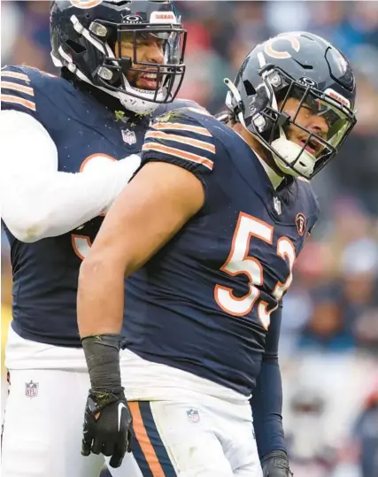  ?? JOHN J. KIM/CHICAGO TRIBUNE ?? Bears linebacker T.J. Edwards, right, and defensive end Montez Sweat celebrate after a stop on third down against the Lions on Dec. 10 at Soldier Field.