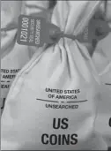  ??  ?? UNSEARCHED: Pictured above are the unsearched Vault Bags loaded with nearly 3 pounds of U.S. Gov’t issued coins some dating back to the 1800’s being handed over to Virginia residents by Federated Mint.