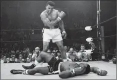  ?? AP/ JOHN ROONEY ?? Fifty years ago, then- heavyweigh­t champion Muhammad Ali knocked out challenger Sonny Liston with a short hard right to the jaw in the fi rst round of their controvers­ial title fi ght in Lewiston, Maine, on May 25, 1965.