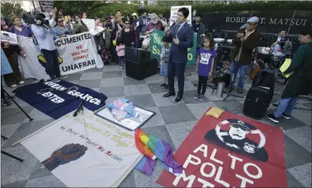  ??  ?? State Sen. Kevin de Leon, D-Los Angeles, speaks at demonstrat­ion outside the federal courthouse where a federal judge will hear arguments over the U.S. Justice Department’s request to block three California laws that extend protection­s to people in the...