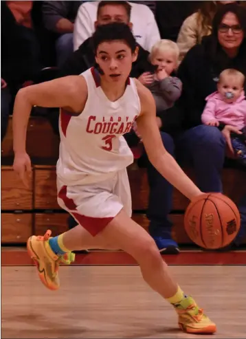  ?? PHOTOS COURTESY OF TRETT BISHOP ?? Upper Lake High School senior Maddy Young is the co-most valuable player on the 2023editio­n of the All-Lake County girls basketball team as selected by the Record-Bee. A defensive standout for the Cougars, she shares the award with teammate and fellow senior Taylar Minnis, the Cougars' leading scorer.