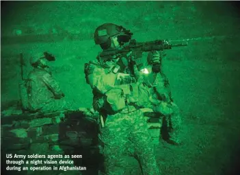  ??  ?? US Army soldiers agents as seen through a night vision device during an operation in Afghanista­n