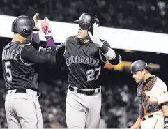  ?? Marcio Jose Sanchez / Associated Press ?? Colorado’s Trevor Story (27) celebrates after his first home run of the year, a two-run shot off Madison Bumgarner in the fourth.