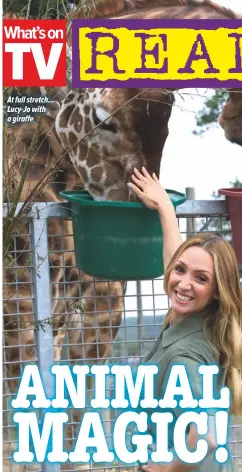  ??  ?? At full stretch... Lucy-Jo with a giraffe