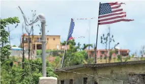  ?? CARLOS GIUSTI/AP FILE ?? Puerto Rico only recently started permanent repairs on an aging power grid razed by Hurricane Maria, a Category 4 storm that struck the island in September 2017. Since then, power outages have become a common occurrence, disrupting daily life on the island.