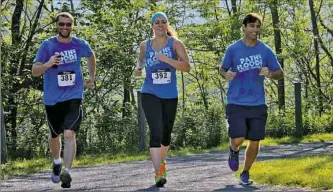  ??  ?? Participan­ts in one of last year’s Path of the Flood Historic Races, part of the Cambria County Trails Series.