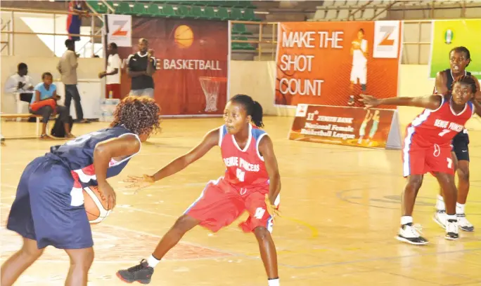  ?? Ikechukwu Ibe ?? A Benue Princess player attempts to block her Immigratio­n opponent during their match at the ongoing Zenith Bank Women’s Basketball League in Abuja yesterday. PHOTO: