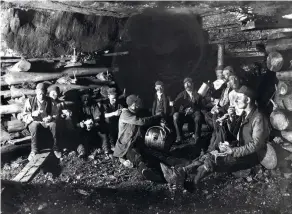  ??  ?? Miners at Ramrod Hall Colliery, near Oldbury in Staffordsh­ire, take a break for food, c1890s