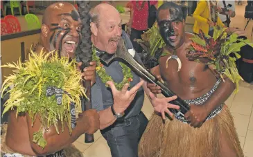  ?? Photo: Waisea Nasokia ?? Sigrist Hans-Peter with traditiona­l Fijian warriors Kitione Nawaite (left) and Epeli Katisawani after disembarki­ng from the Edelweiss Air chartered aircraft at the Nadi Internatio­nal Airport on September 13, 2018.