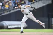  ?? DENIS POROY — THE ASSOCIATED PRESS ?? San Francisco Giants shortstop Nick Ahmed throws out the San Diego Padres' Fernando Tatis Jr. at first base during the fifth inning Saturday in San Diego.