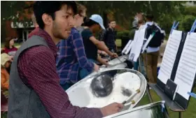  ?? (Photo by Charlie Benton, SDN) ?? Nikhil Menon performs on the Drill Field with the Mississipp­i State University Steel Pan Ensemble. The group performed an hour-long concert Tuesday, performing Caribbean and pop selections.