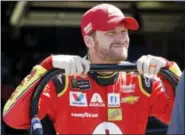  ?? ALEX GALLARDO — THE ASSOCIATED PRESS ?? Dale Earnhardt Jr. waits in the garage area prior to the opening practice session in Fontana, California, on Friday.