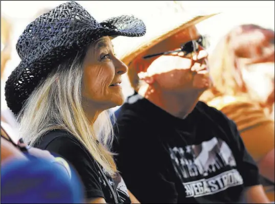  ?? Brett Le Blanc Las Vegas Review-Journal ?? April Hannewald and her husband, Dennis, watch The Rhyolite Sound perform Saturday the Country58 benefit concert.