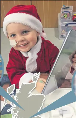  ??  ?? Callum gets his Santa suit on in hospital unit