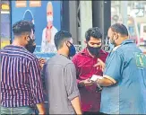  ??  ?? BMC officials fine citizens for violating Covid-19 norms at CSMT on Friday.