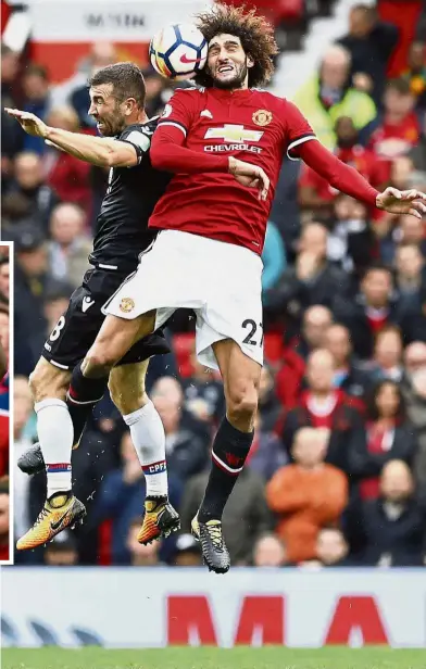  ??  ?? Headed for success: Manchester United’s Marouane Fellaini (right) going up for a header with Crystal Palace’s James McArthur in the English Premier League match at Old Trafford on Saturday. Inset: Romelu Lukaku celebratin­g after scoring the fourth goal...