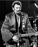  ?? NABIL MOUNZER/EPA 2003 ?? Johnny Hallyday, who fashioned his stage aura after Elvis Presley, sold more than 100 million records.