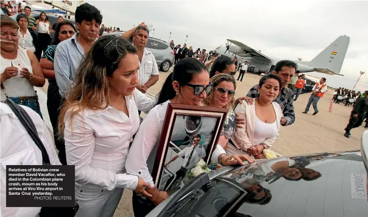  ??  ?? Relatives of Bolivian crew member David Vacaflor, who died in the Colombian plane crash, mourn as his body arrives at Viru Viru airport in Santa Cruz yesterday.