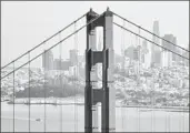  ?? Josh Edelson For The Times ?? THE SAN FRANCISCO skyline as seen through the Golden Gate Bridge.