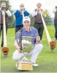  ?? EPA ?? Matthew Fitzpatric­k with the trophy.