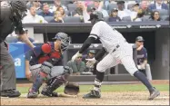  ?? Bill Kostroun / Associated Press ?? Didi Gregorius checks with Twins catcher Jason Castro after Gregorius tossed his bat after hitting a three-run home run during the fourth inning on Wednesday in New York.