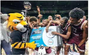  ?? (AP photo/Butch Dill) ?? Texas Southern players punch their ticket to March Madness Saturday by defeating Grambling State in an NCAA college basketball game in the championsh­ip of the Southweste­rn Athletic Conference tournament in Birmingham, Ala.