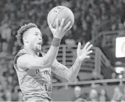  ?? Michael Dwyer / Associated Press ?? Boston College’s Ky Bowman soars to the basket to score two of his game-high 30 points in the Eagles’ 89-84 upset of No. 1 Duke on Saturday.