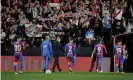  ?? Pozo/AFP/Getty Images ?? Rayo Vallecano supporters taunt Barcelona’s players and Ronald Koeman (third left) as they leave the pitch after the Dutchman’s team lost 1-0. Photograph: Óscar del