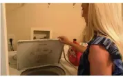  ?? Courtesy of Emily Visnic ?? A Barry University student found a python in the washing machine of her West Palm Beach apartment on Friday.