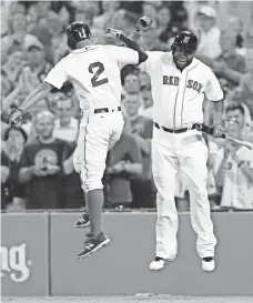  ?? MARK L. BAER, USA TODAY SPORTS ?? The Red Sox’s Xander Bogaerts, left, and David Ortiz put up impressive statistics in the first half of the season.