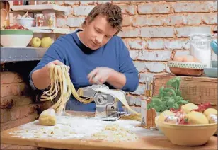 ??  ?? HANDS ON: Jamie Oliver gets stuck in with pasta making – perfect with freshly grated Parmesan cheese.
