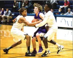  ?? CAMERON FLAISCH / For the Calhoun Times ?? Calhoun's Kaelan Riley (left) and Jireh Wilson (right) trap a Darlington player during Wednesday's game in the Rome News-Tribune Holiday Festival at Berry College.
