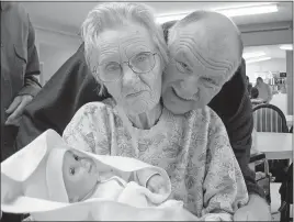  ?? [SANDY CAMBRON] ?? Pearl Walker with her son, Wayne Cambron, after she was given a baby doll in 2005 as Alzheimer’s therapy. The Pearl’s Memory Babies charity is named after her.