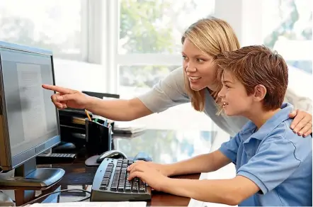  ??  ?? Supervisin­g or checking homework shows children you care. Some schools run courses to equip parents to help their child with school work.