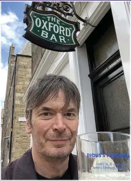  ??  ?? CHEERS: Ian Rankin celebrates his 60th outside Edinburgh’s Oxford Bar