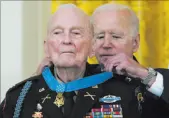  ?? Alex Brandon The Associated Press ?? President Joe Biden presents the Medal of Honor to retired Army Col. Ralph Puckett on Friday in the East Room of the White House.