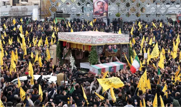  ?? AFP ?? Mourners in Tehran attend the funeral of Razi Mousavi, a senior commander in the IRGC who was killed on December 25 in an Israeli strike