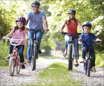  ?? PHOTO ?? To help ensure that everyone meets their fitness goals, consider combining fun family quality time with your workouts. ADOBE STOCK