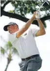  ??  ?? Defending champ Matt Kuchar gets some practice in at Waialae Country Club in Honolulu.