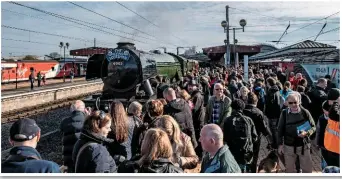  ?? JACK BOSKETT/ RAIL. ?? Crowds mass around 60103 FlyingScot­sman after its arrival at York on April 23.