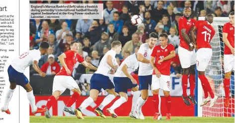  ?? REUTERSPIX ?? England’s Marcus Rashford (left) takes a freekick during yesterday’s internatio­nal football friendly against Switzerlan­d at the King Power stadium in Leicester. –