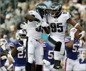  ?? MICHAEL PEREZ - AP FILE ?? The Philadelph­ia Eagles’ Mychal Kendricks, right, and Nigel Bradham celebrate after Kendricks’ intercepti­on during a preseason game against the Buffalo Bills on Aug. 17, 2017, in Philadelph­ia. Kendricks was released by the Eagles Tuesday.